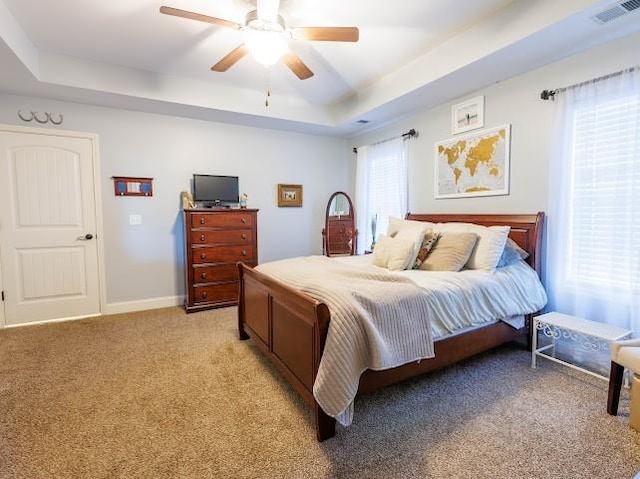 302 Janie St, Smyrna, TN 37167 - bedroom featuring a tray ceiling, light carpet, and a ceiling fan