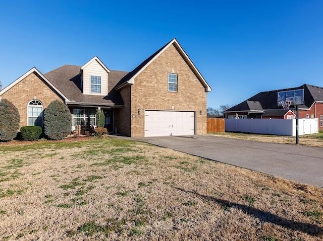 302 Janie St, Smyrna, TN 37167 - traditional-style house with a garage, brick siding, and asphalt driveway