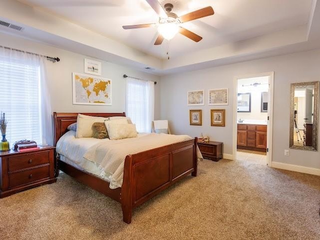 302 Janie St, Smyrna, TN 37167 - bedroom with a raised ceiling, light colored carpet, connected bathroom, and baseboards