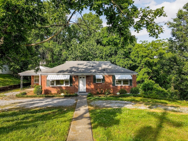 3310 Glencliff Rd, Nashville, TN 37211 - view of front of property with brick siding, a front lawn, and roof with shingles