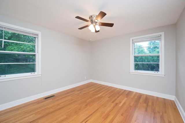 3310 Glencliff Rd, Nashville, TN 37211 - empty room with healthy amount of natural light, light wood-style floors, baseboards, and ceiling fan