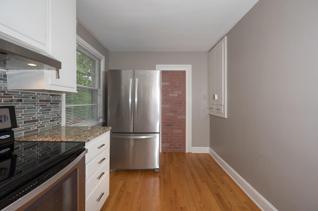 3310 Glencliff Rd, Nashville, TN 37211 - kitchen featuring stainless steel appliances, light wood-type flooring, baseboards, and white cabinets