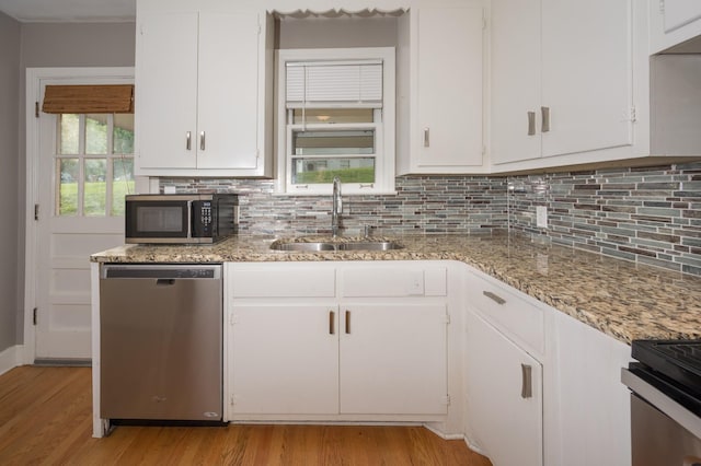 3310 Glencliff Rd, Nashville, TN 37211 - kitchen with stainless steel appliances, a sink, decorative backsplash, and light wood finished floors