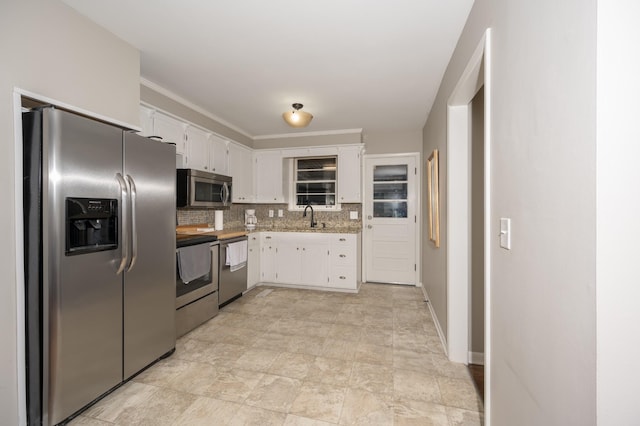 3310 Glencliff Rd, Nashville, TN 37211 - kitchen with appliances with stainless steel finishes, a sink, white cabinetry, and light countertops