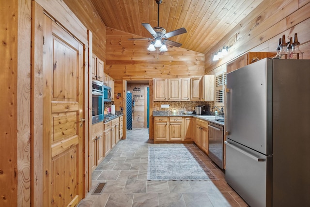 10120 Lascassas Pike, Lascassas, TN 37085 - kitchen featuring appliances with stainless steel finishes, wood walls, light stone finish floors, lofted ceiling, and wooden ceiling