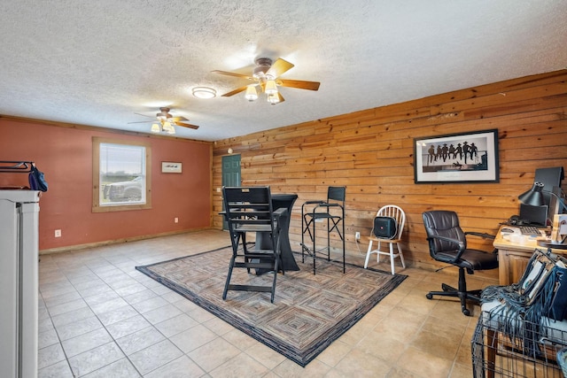 10120 Lascassas Pike, Lascassas, TN 37085 - dining room featuring ceiling fan, a textured ceiling, wooden walls, light tile patterned floors, and baseboards