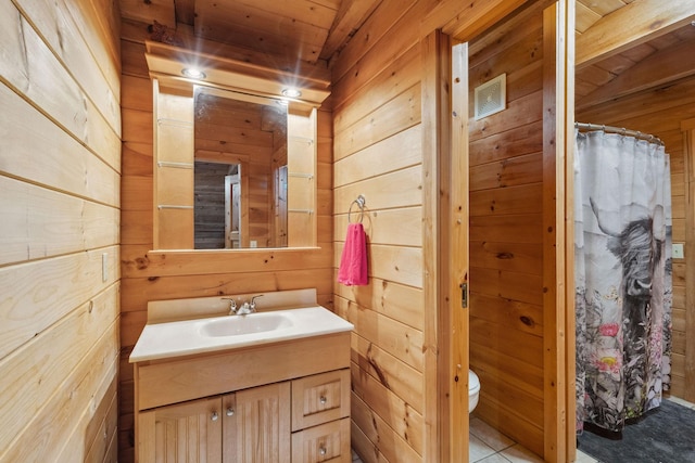 10120 Lascassas Pike, Lascassas, TN 37085 - full bathroom with wood walls, vanity, toilet, a shower with shower curtain, and tile patterned floors