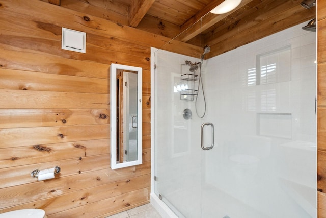 10120 Lascassas Pike, Lascassas, TN 37085 - full bath featuring a stall shower, wood ceiling with exposed beams, wood walls, tile patterned floors, and toilet