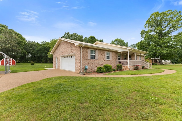 111 Hickory Trce, Lyles, TN 37098 - view of front of home with a porch, driveway, a front lawn, brick siding, and a garage