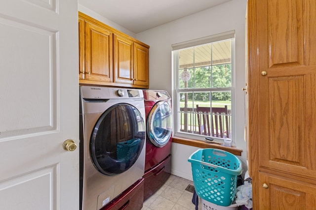 111 Hickory Trce, Lyles, TN 37098 - clothes washing area featuring separate washer and dryer, cabinet space, and light tile patterned floors