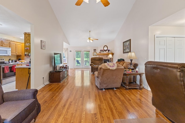 111 Hickory Trce, Lyles, TN 37098 - living room featuring ceiling fan, light wood finished floors, baseboards, and high vaulted ceiling