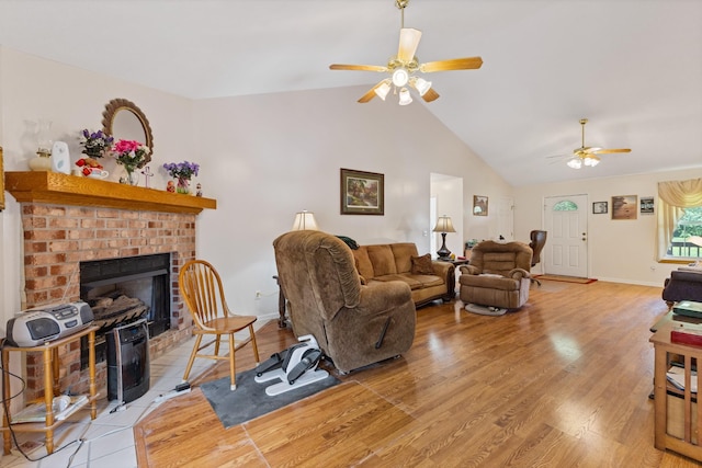 111 Hickory Trce, Lyles, TN 37098 - living area with ceiling fan, lofted ceiling, a brick fireplace, light wood finished floors, and baseboards
