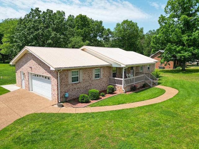 111 Hickory Trce, Lyles, TN 37098 - single story home featuring covered porch, brick siding, driveway, a front lawn, and a garage