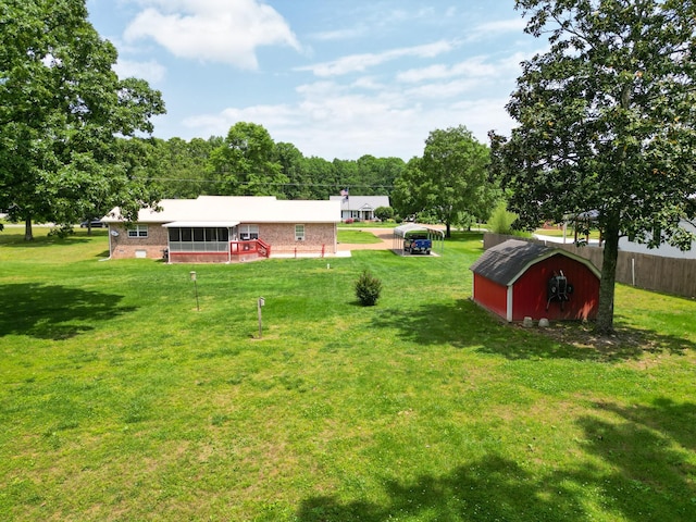 111 Hickory Trce, Lyles, TN 37098 - view of green lawn featuring a storage shed and an outdoor structure