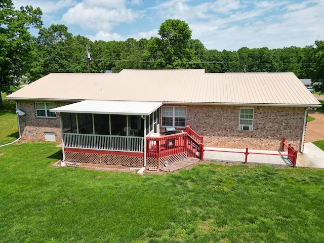 111 Hickory Trce, Lyles, TN 37098 - back of house with brick siding, a sunroom, a lawn, and metal roof