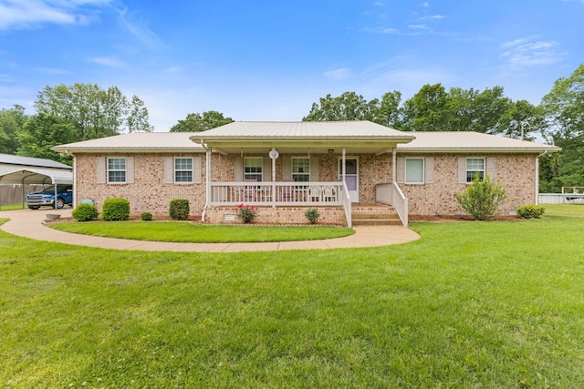 111 Hickory Trce, Lyles, TN 37098 - single story home featuring a porch, a front lawn, a carport, metal roof, and brick siding