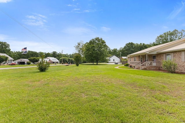 111 Hickory Trce, Lyles, TN 37098 - view of grassy yard featuring a porch