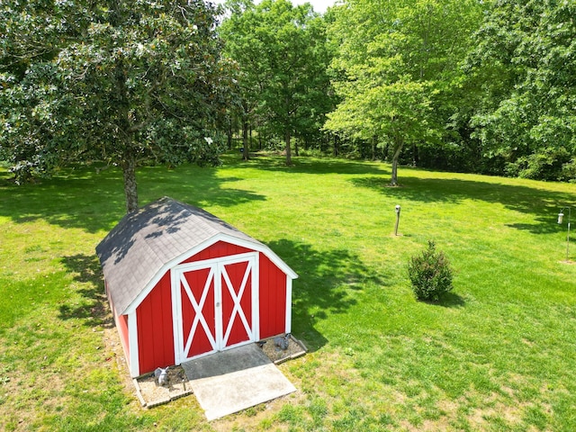 111 Hickory Trce, Lyles, TN 37098 - view of green lawn featuring a shed and an outbuilding