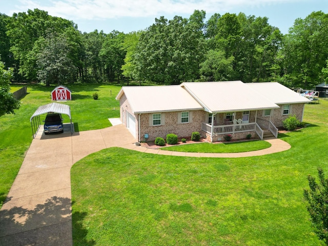 111 Hickory Trce, Lyles, TN 37098 - single story home with a porch, a front lawn, brick siding, and a detached carport