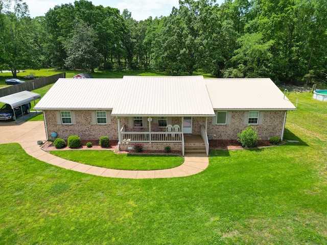 111 Hickory Trce, Lyles, TN 37098 - ranch-style house featuring a porch, brick siding, a front yard, and metal roof