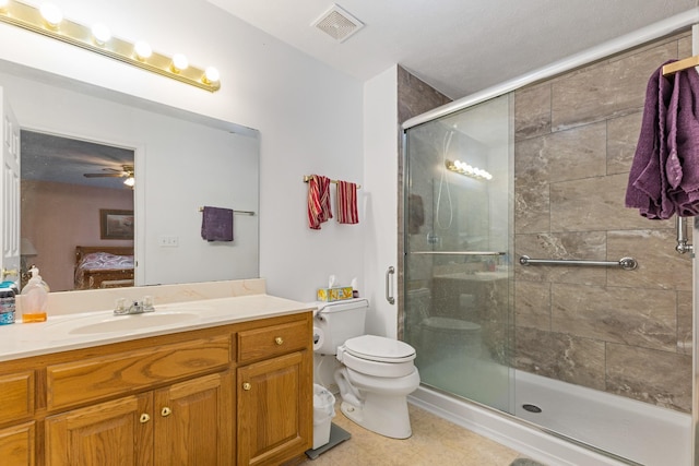 111 Hickory Trce, Lyles, TN 37098 - ensuite bathroom featuring a stall shower, toilet, vanity, and ceiling fan