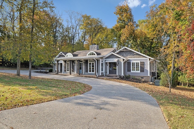 301 Anchor Ln, Old Hickory, TN 37138 - view of front of home with curved driveway, a chimney, a porch, a front yard, and crawl space