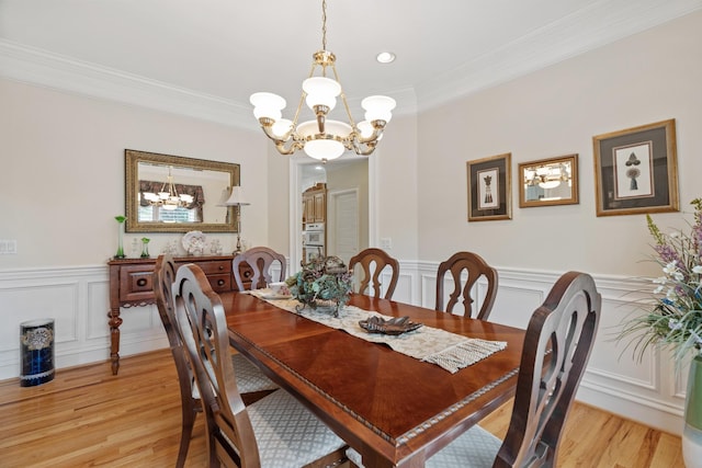 2039 Sparta Pike, Lebanon, TN 37090 - dining room with a chandelier, light wood finished floors, ornamental molding, a decorative wall, and wainscoting