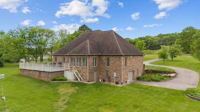 2039 Sparta Pike, Lebanon, TN 37090 - rear view of house with stairway, driveway, an attached garage, and a yard