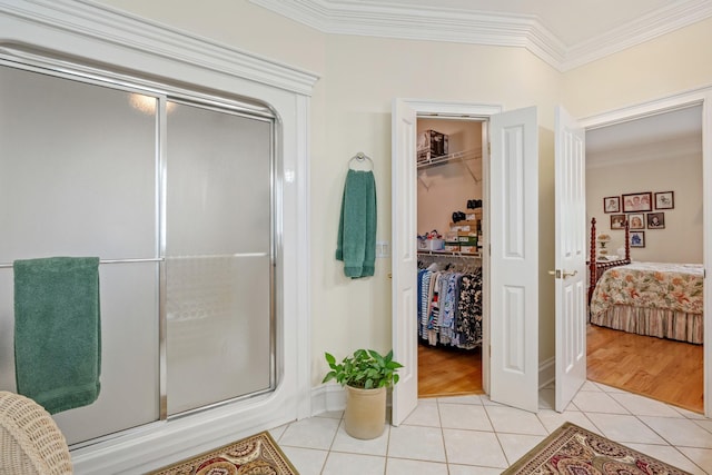 2039 Sparta Pike, Lebanon, TN 37090 - full bath featuring a shower stall, tile patterned flooring, ornamental molding, connected bathroom, and a spacious closet