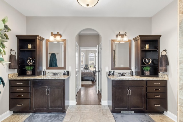 201 Josie Ln, Clarksville, TN 37043 - ensuite bathroom featuring two vanities and baseboards