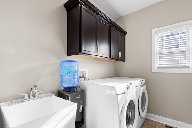 201 Josie Ln, Clarksville, TN 37043 - washroom featuring washer and dryer, cabinet space, and baseboards