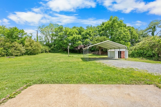 2705 Thrush Dr, Clarksville, TN 37040 - view of grassy yard with a carport and gravel driveway