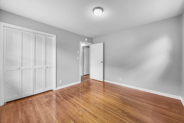 2705 Thrush Dr, Clarksville, TN 37040 - unfurnished bedroom featuring baseboards, wood finished floors, and a closet