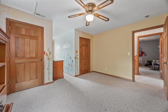 unfurnished bedroom with light carpet, baseboards, and ceiling fan