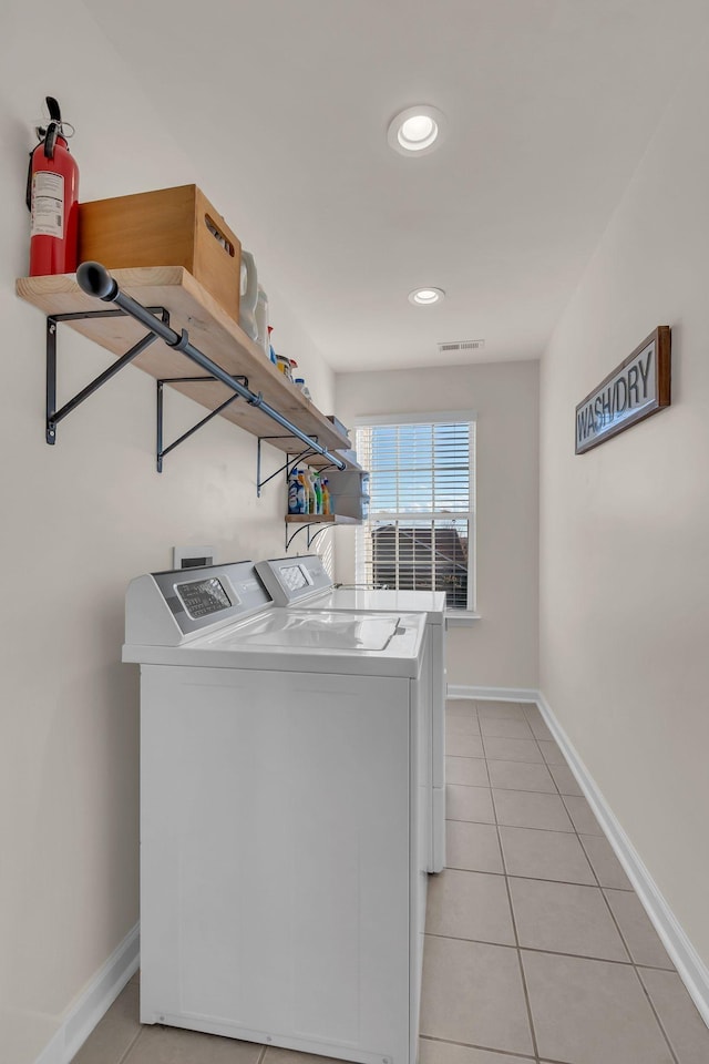 1032 Neeleys Bnd, Spring Hill, TN 37174 - washroom with washer and clothes dryer, light tile patterned floors, baseboards, and recessed lighting
