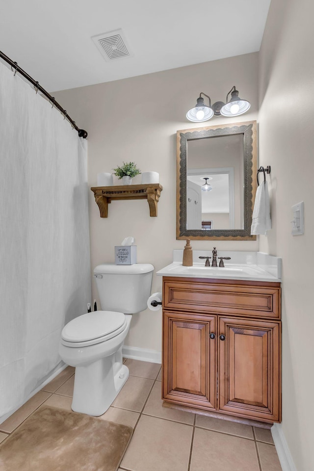 1032 Neeleys Bnd, Spring Hill, TN 37174 - bathroom featuring tile patterned floors, toilet, vanity, and baseboards