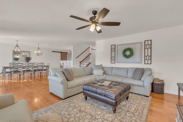 1032 Neeleys Bnd, Spring Hill, TN 37174 - living area featuring light wood-type flooring, a ceiling fan, and stairs