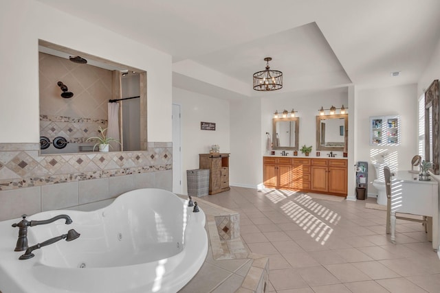 1032 Neeleys Bnd, Spring Hill, TN 37174 - full bath featuring a tub with jets, a chandelier, tile patterned flooring, a tile shower, and double vanity