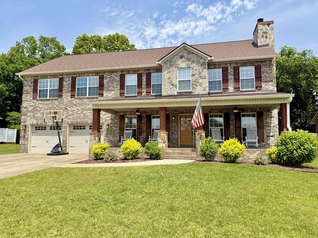 1032 Neeleys Bnd, Spring Hill, TN 37174 - view of front of home featuring concrete driveway, a chimney, a garage, a front yard, and brick siding