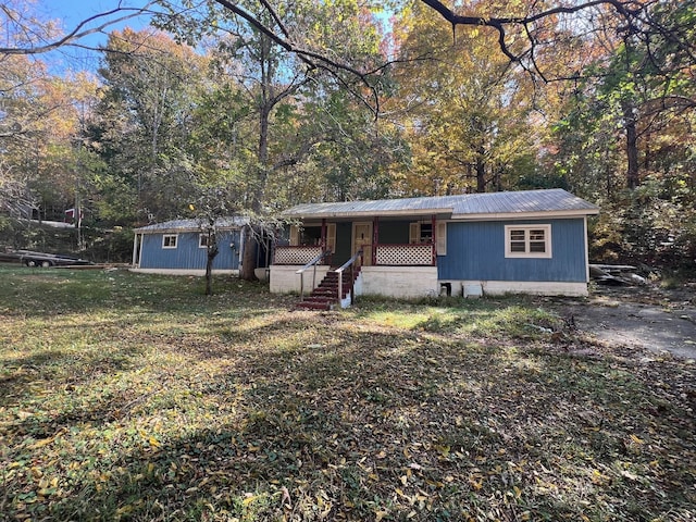 235 Ernest Looper Rd, Rickman, TN 38580 - manufactured / mobile home with a porch, metal roof, and a front yard