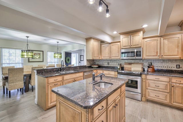 1880 E Compton Rd, Murfreesboro, TN 37130 - kitchen featuring stainless steel appliances, a sink, dark stone counters, light wood-style flooring, and recessed lighting