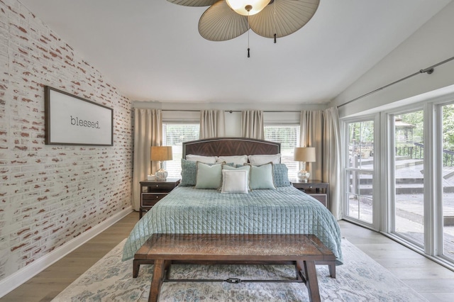 1880 E Compton Rd, Murfreesboro, TN 37130 - bedroom featuring vaulted ceiling, multiple windows, access to outside, wood finished floors, and ceiling fan