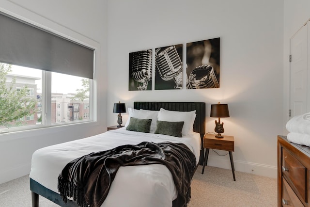bedroom with carpet floors and baseboards