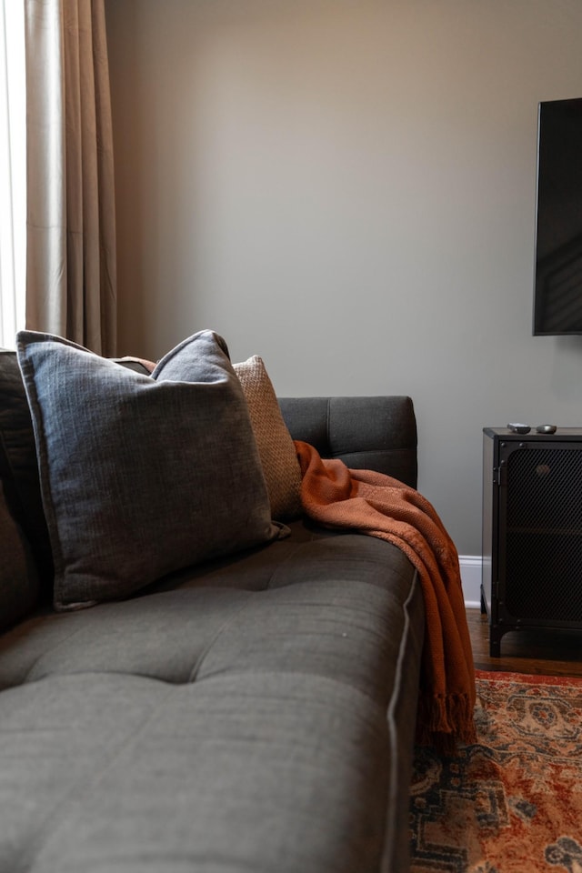 bedroom featuring wood finished floors and baseboards