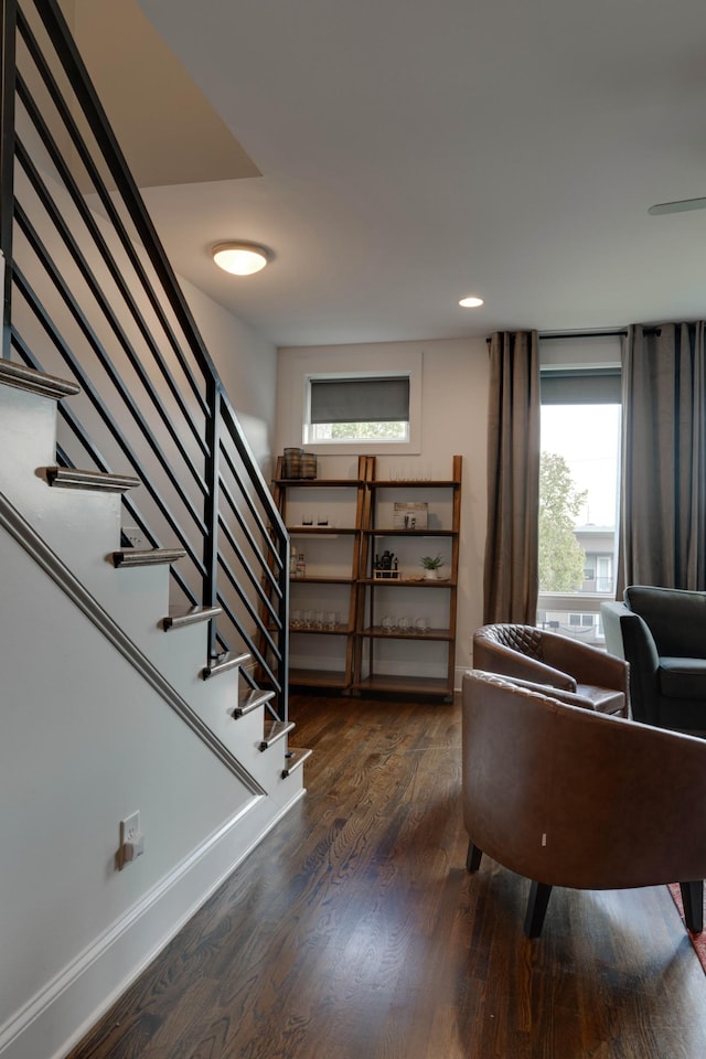 interior space featuring wood finished floors, stairs, and recessed lighting