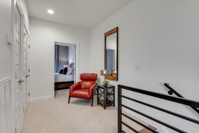 living area with carpet floors, baseboards, and recessed lighting