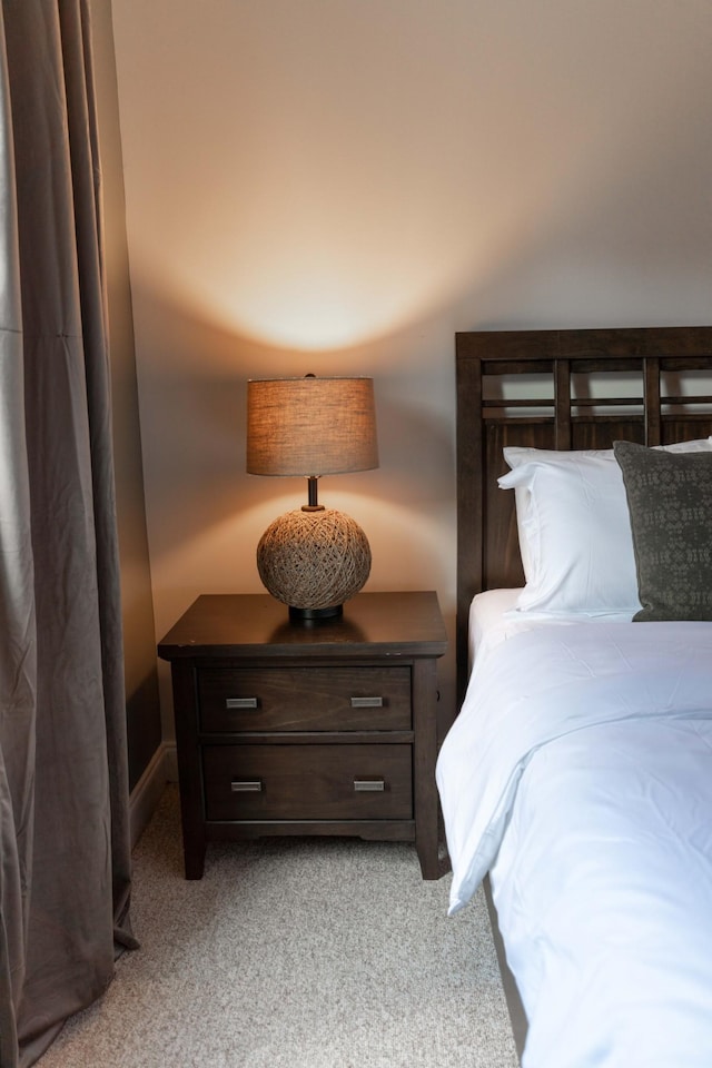 bedroom featuring light carpet