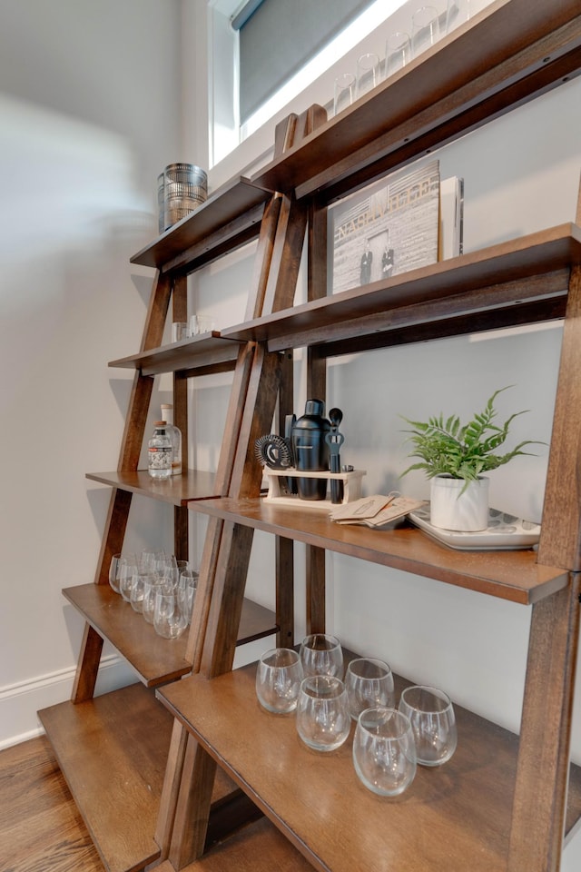 detailed view of baseboards and wood finished floors