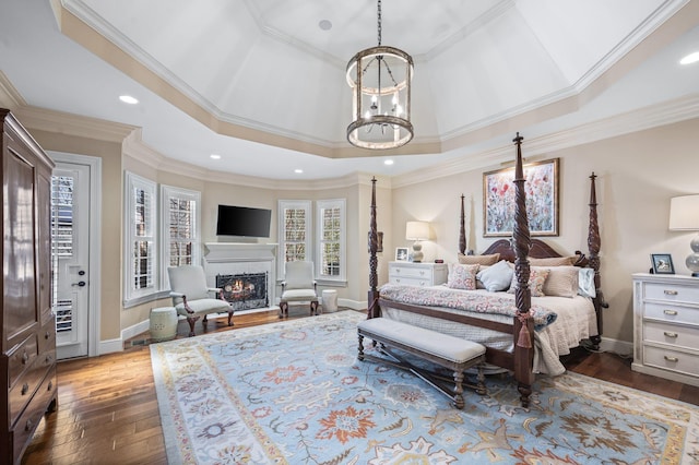 bedroom with baseboards, a warm lit fireplace, a chandelier, ornamental molding, and recessed lighting