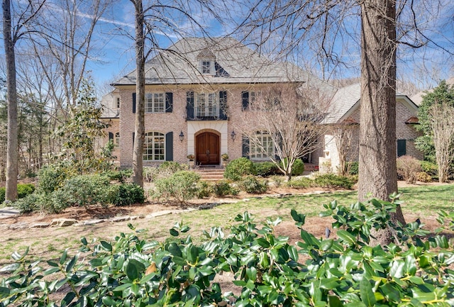 georgian-style home featuring brick siding